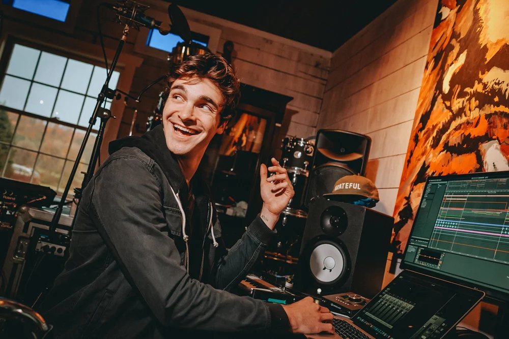 Devon Seegers in his studio: drums, monitors, and a session on the screen